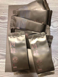 Zhengyan Rou Gui oolong tea sachets, gold packaging