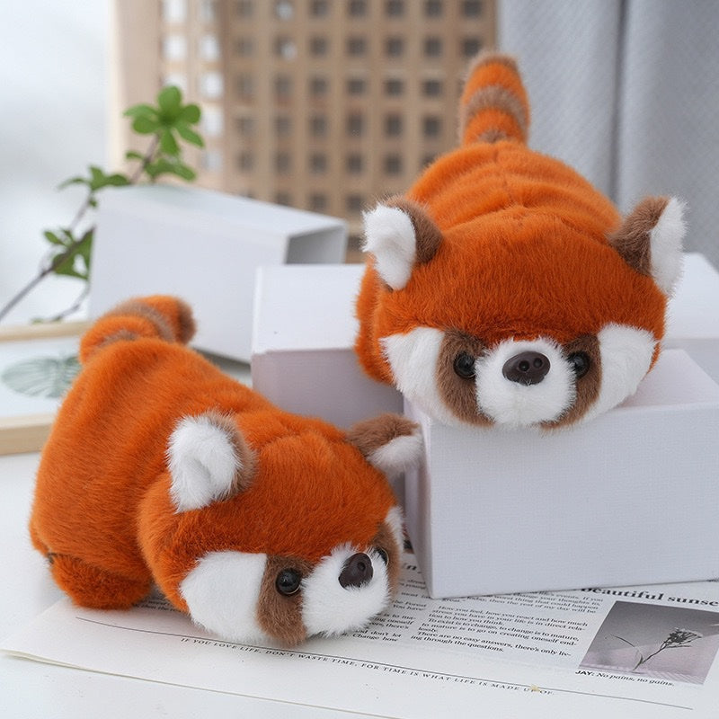 Two red panda plush toys on display