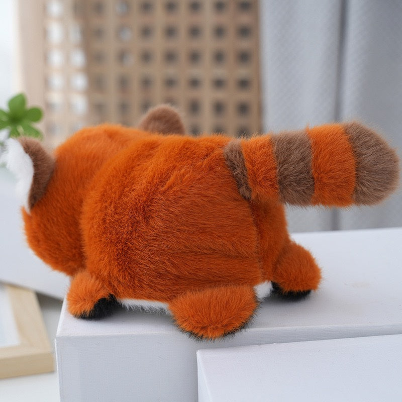 Red panda plush back view showing long striped tail